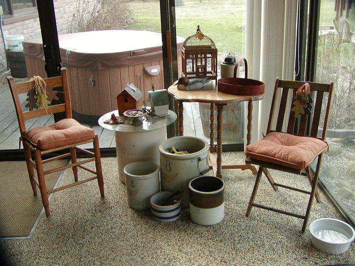 my three seasons porch decorated with mostly finds and vintage, outdoor living, repurposing upcycling, A decorative corner area features an old table found by answering a For Sale adv a collection of crocks and roadside rescue chairs with new Wallmart cushions