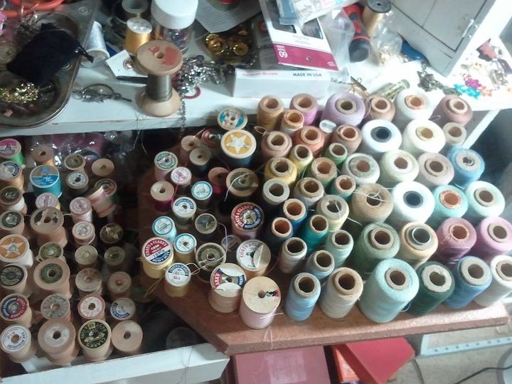 q old thread, crafts, Empty wooden thread spools on the left new and old thread on the right