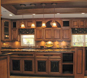 design tip are you trying to add interest to your kitchen there is a tendency when, appliances, home decor, kitchen design, kitchen island, Add color to the front of a few doors to enhance the artchitecture of the cabinetry