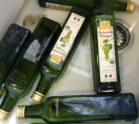 A blogger soaks leftover glass bottles in the sink. What they I