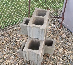 She stacks six cinder blocks in their garden. A few steps later? This