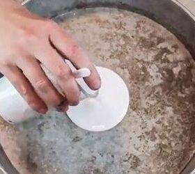 She does this to a spare baking pan & hangs it behind her toilet