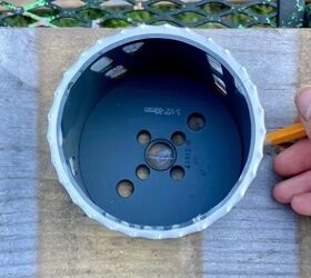 She measures flower pots for a decor idea that's <em>much</em> cooler than a gallery wall