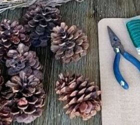 The secret to your prettiest front door yet? Just use 7 pine cones & 7 fake flowers...