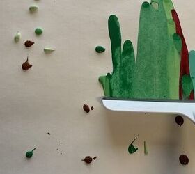 Drag a squeegee through paint to copy this brilliant holiday art idea