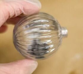 She pours vinegar into a plastic ornament to create this gorgeous effect