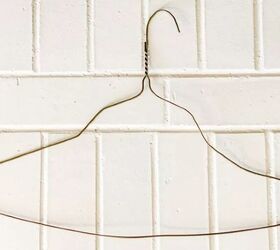 Bend a hanger out of shape to make your houseplants look so much prettier