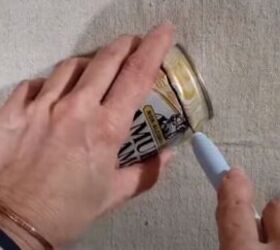 She flattens empty beer and soda cans for this gorgeous, $2 garden hack