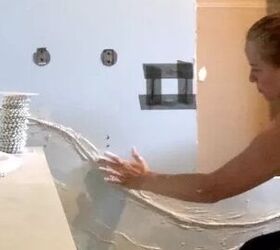 She presses beads against her bathroom wall for this mind-blowing upgrade