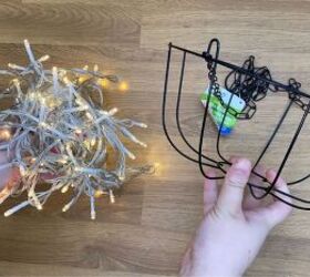 She wraps string lights around a dollar store basket for a gorgeous garden idea