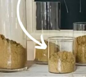 She pours sand into a few glass vases to make her home look gorgeous for the 4th
