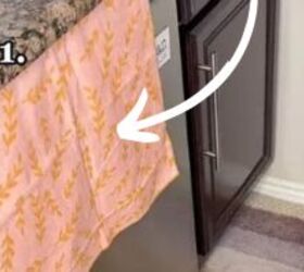 She puts a dish towel over her dishwasher door for a brilliant hack