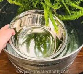 She puts a metal bowl inside a large metal bucket for a gorgeous way to solve this very common problem