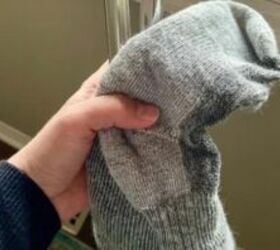 She turns a fluffy pair of socks inside out for this easy cleaning hack