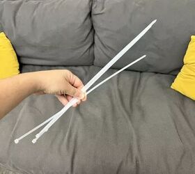 She grabs 2 packs of zip ties for this unique bedroom upgrade