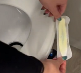 Why she sticks a clean sanitary pad on the side of her toilet (smart!)