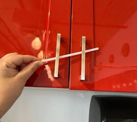 She cuts up a few straws for this 2-minute trick to upgrade her kitchen cabinets for Christmas