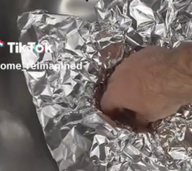 She presses a piece of foil into her kitchen sink drain for this clever trick