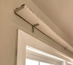 She hangs a plank above her window for this beautiful decor hack