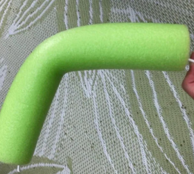 She uses a hanger and a pool noodle for the best porch idea we've seen in months