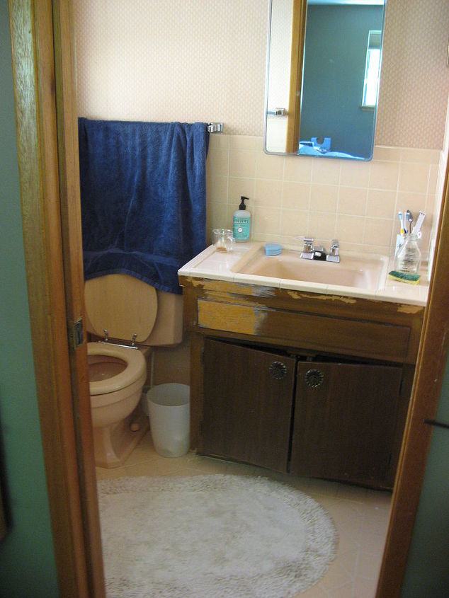 this is a wonderful example of taking a 1960 s original master bathroom in dire need, bathroom ideas, home improvement, The before photo Wallpaper everywhere no fan so there was peeling wallpaper and pink tile everywhere