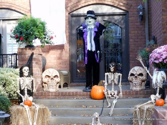 scary outdoor halloween decorations, halloween decorations, porches, seasonal holiday decor, Skeletons greet visitors