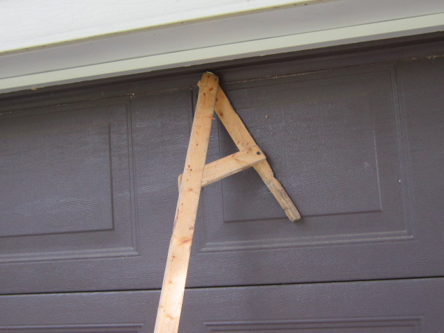 homemade gutter cleaner, curb appeal, home maintenance repairs, My homemade gutter cleaner is a 1x2x10 piece of lumber with a V type end and a cross brace