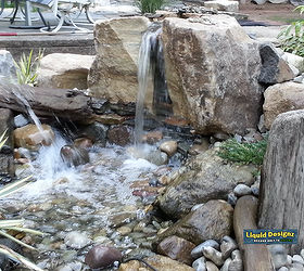 a knockout beautiful pondless waterfall greets our guests as they visit the liquid, landscape, lighting, ponds water features, And then there was one