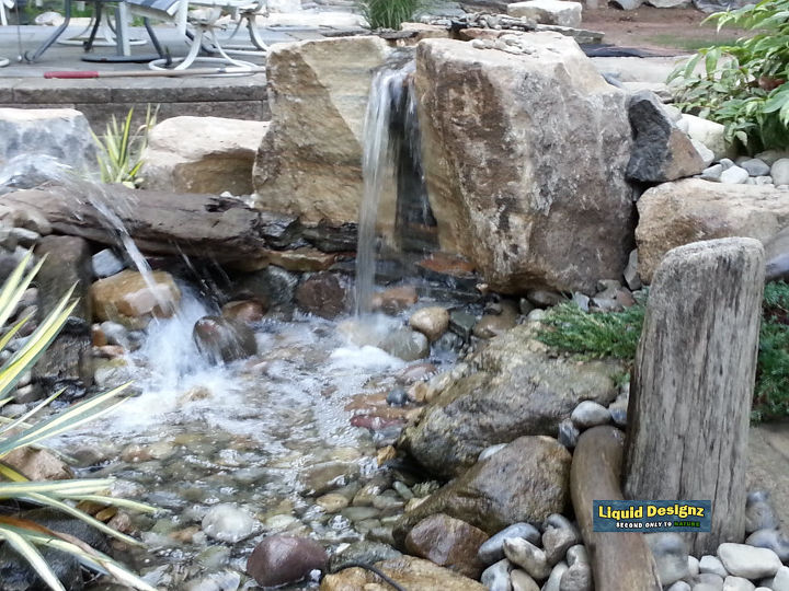 a knockout beautiful pondless waterfall greets our guests as they visit the liquid, landscape, lighting, ponds water features, And then there was one