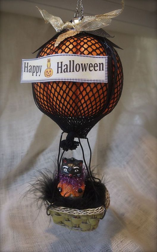 flying pumpkins, halloween decorations, seasonal holiday d cor, embellish with a banner and feather accent