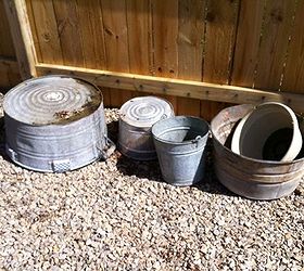 annie s galvanized tipsy pots, container gardening, flowers, gardening, outdoor living, ponds water features, repurposing upcycling, Galvanized tubs and buckets needed and one other thing a metal conduit pipe