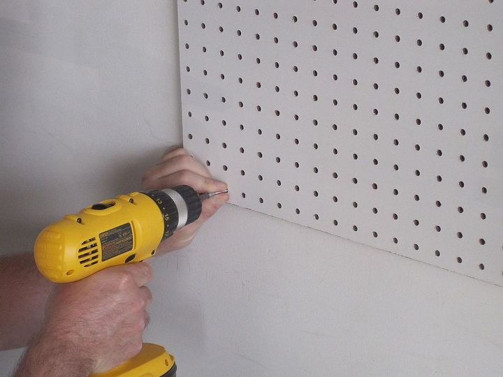 organize your garage for 25 bucks, garages, organizing, Tip For best results strategically hang up your peg board so that it is connected to a stud for support Also use the bumpers provided in your hanger packet to allow space behind the peg board for the hooks