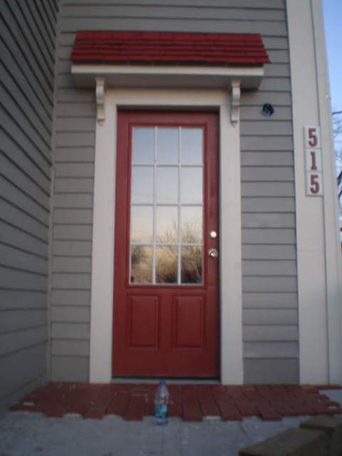 house exterior renovation, new front door with new little awning to match the other trim