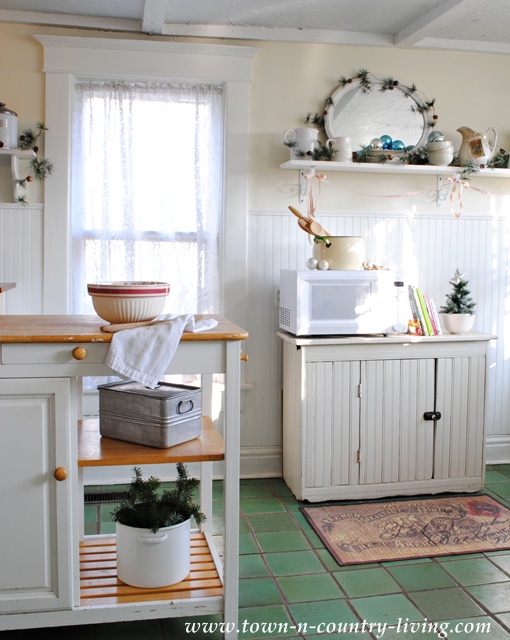 the secret to creating farmhouse christmas style in your kitchen, kitchen design, seasonal holiday decor, Simplicity is key to creating the farmhouse look A red striped bowl and a small ironstone bowl cradling a Christmas tree add understated holiday spirit