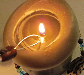 candle snuffer with dingle dangle bling, With the looped end press the wick down into the wax The fire will instantly go out WITHOUT any smoke or smell