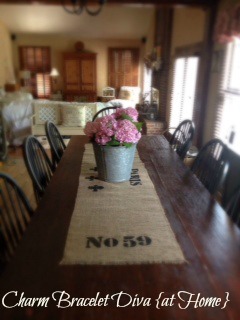cultivating vintage style with buckets and burlap, flowers, home decor, repurposing upcycling, Vintage looking displays like this one work well on this reclaimed red barn wood farmhouse table