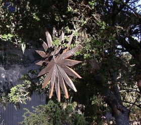 a rustic cabin chair with flying finials, diy, repurposing upcycling, seasonal holiday decor, woodworking projects, A hanging redwood star about 40 in diameter