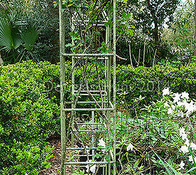 when secret gardens open their doors, flowers, gardening, outdoor furniture, outdoor living, I love these tuteurs for climbing roses made from rebar
