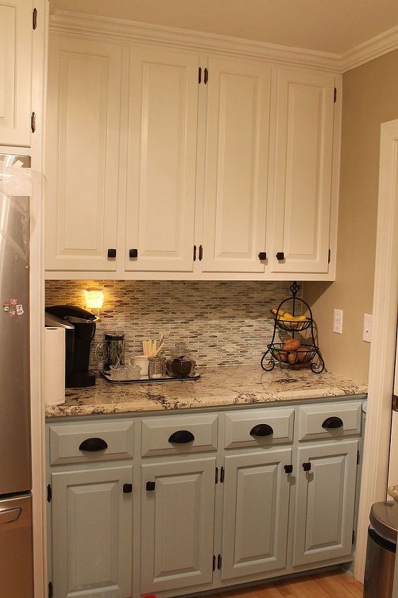 Great new cabinet colors, hardware, granite and tile backsplash!