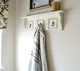 our master bath then and now, bathroom ideas, home decor, Down came the towel rack and up went a little shelf from Home Goods great place the hang the coordinating towel I spotted at Home Goods too