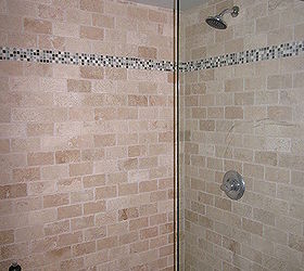 i tore out a fibergladd tub shower combo and replaced it with a beautiful stone, The shower has no door just a glass wall