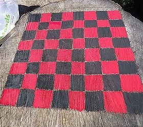 anyone for a game of checkers, outdoor living, I started by drawing out a checkboard on an old stump Painted it with the 64 squares needed