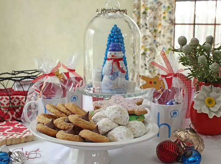 hosting a cookie swap party, seasonal holiday d cor, For a whimsical wonderland centerpiece I place a candy covered tree and chocolate snowman along with marshmallows and candy under my Wayfair cloche