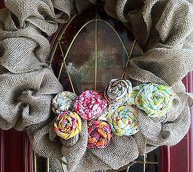 make a burlap ribbon wreath decorate one wreath for all seasons, crafts, home decor, Burlap ribbon wreath with large fabric rosette s Colorful rosettes are the perfect addition to a burlap wreath
