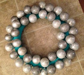 diy ornament wreath, christmas decorations, crafts, seasonal holiday decor, wreaths, Stagger your ornaments as you glue them on After you cover the entire wreath then start layering your smaller ornaments on