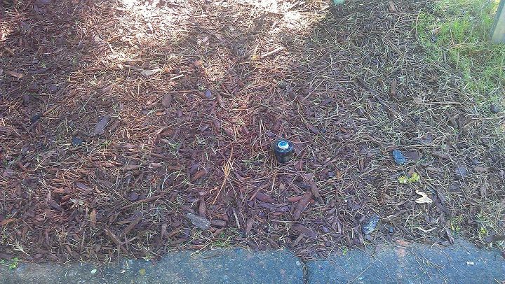 sprinkler heads above ground is this ok, This one is near the curb between my property and my neighbor This is probably the one most likely to be damaged by kids It has to reach over a cable box though to spray the yard The head before would hit the cable box