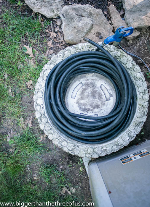upcycled hose caddy from an old fountain top, outdoor living, repurposing upcycling