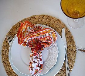 fall tablescape using marigolds, seasonal holiday decor, Bamboo chargers white plates and bright orange and gold linens