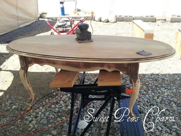 coffee table up cycle in pink, painted furniture, Miss Pink and I got down to business I taped off the underside of the table in order to retain the Lane stamping I then sanded off the original finish leaving a bit of the darker finish remaining in the grooves around the top