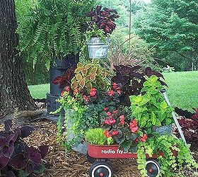 repurposed junk garden, Radio flyer wagon washtub and an old heater repurposed as a plant stand